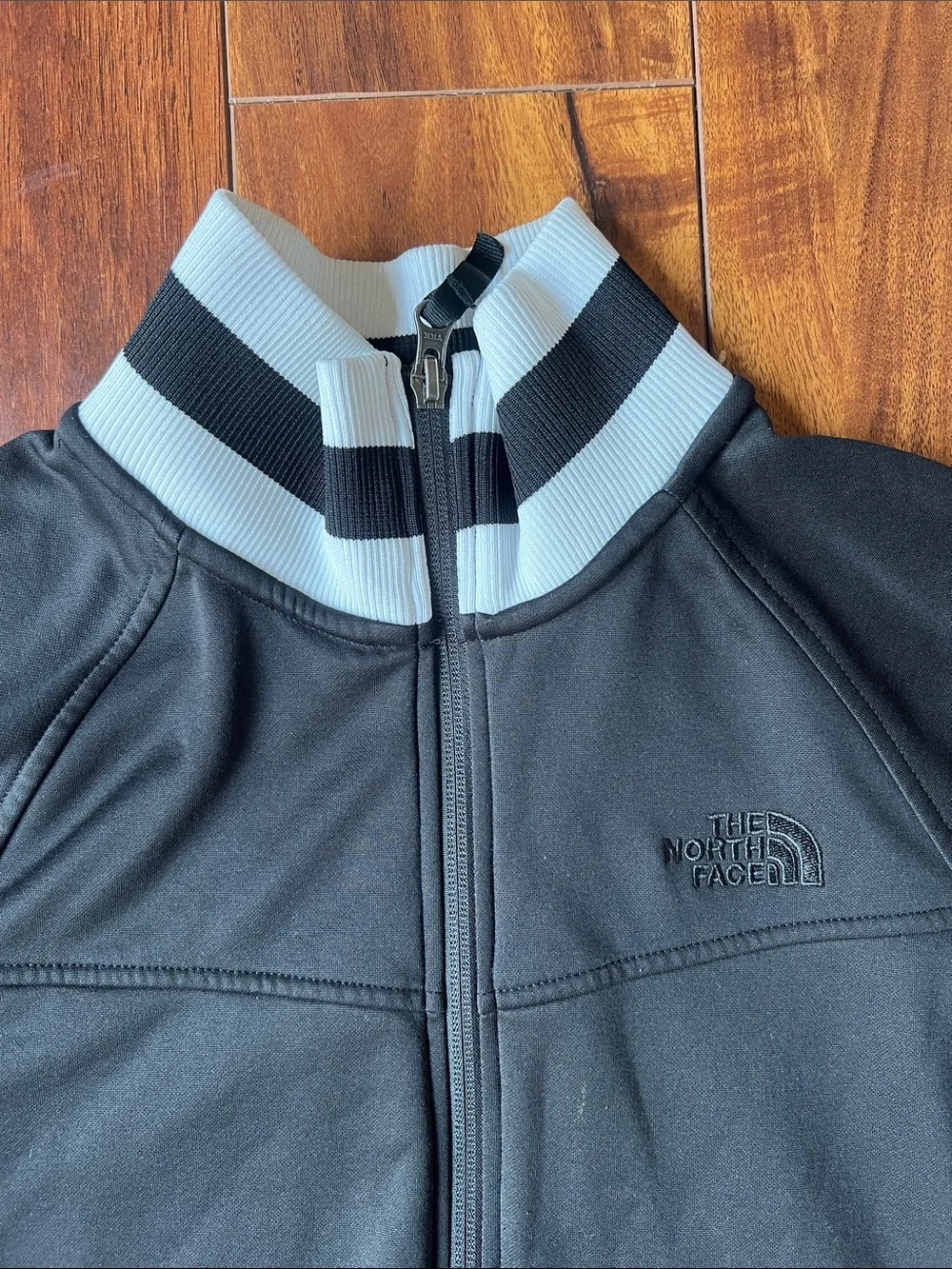 The North Face Kids Black Jacket with White Trim